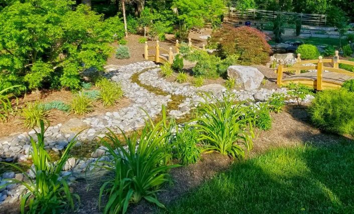 Flower Planting Near Fence Leesburg VA by J Mario Landscaping